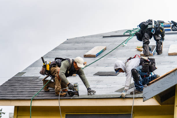 Professional Roofing technician working in Milford, MA